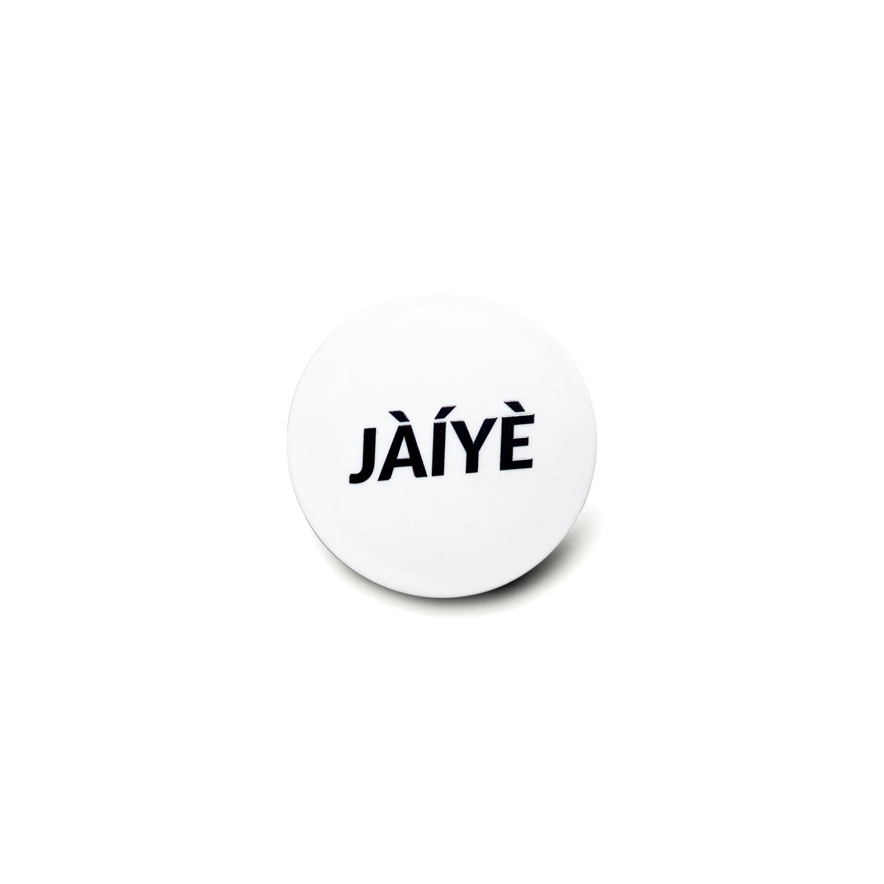 Round white object with 'JAIYE' text on a white background
