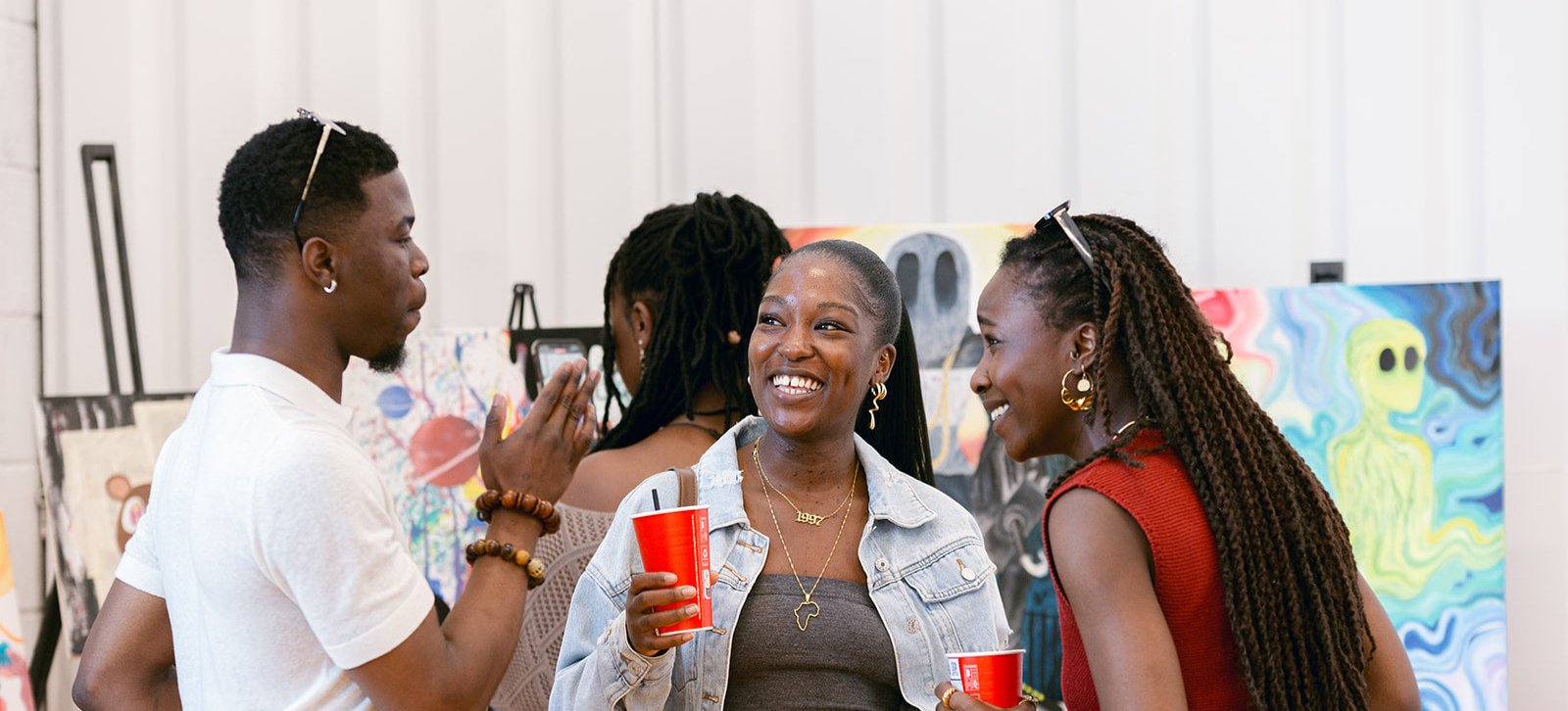 Group of people conversing at BlackOwned Studios event